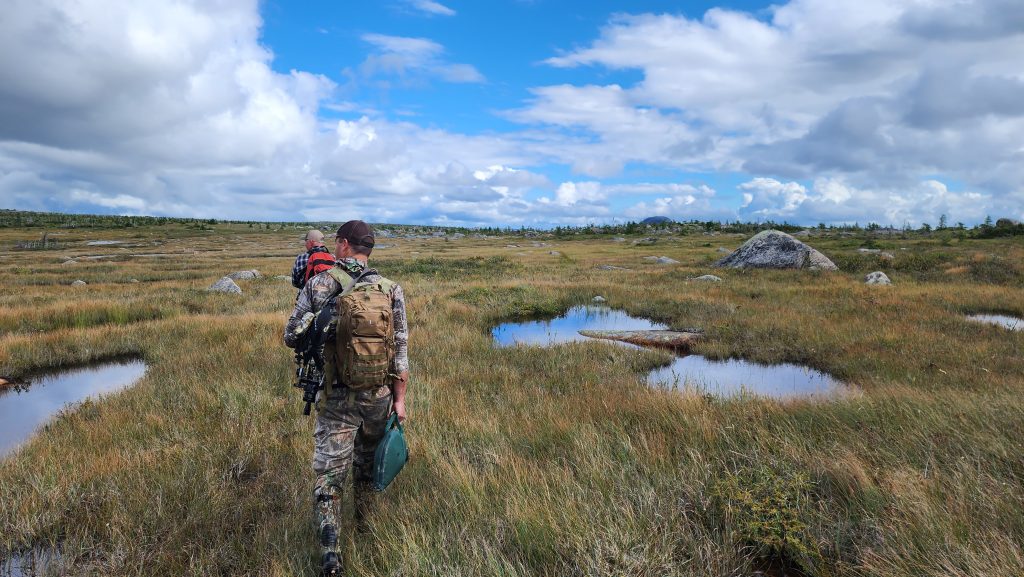 Two men trekking through Newfoundland’s rugged wilderness in pursuit of moose and caribou